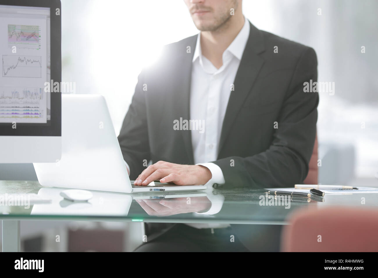 close up.Young man working with a laptop, a human hand on the notebook Stock Photo
