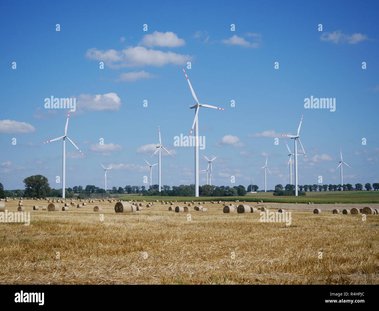 wind turbine on blue sky background Stock Photo - Alamy