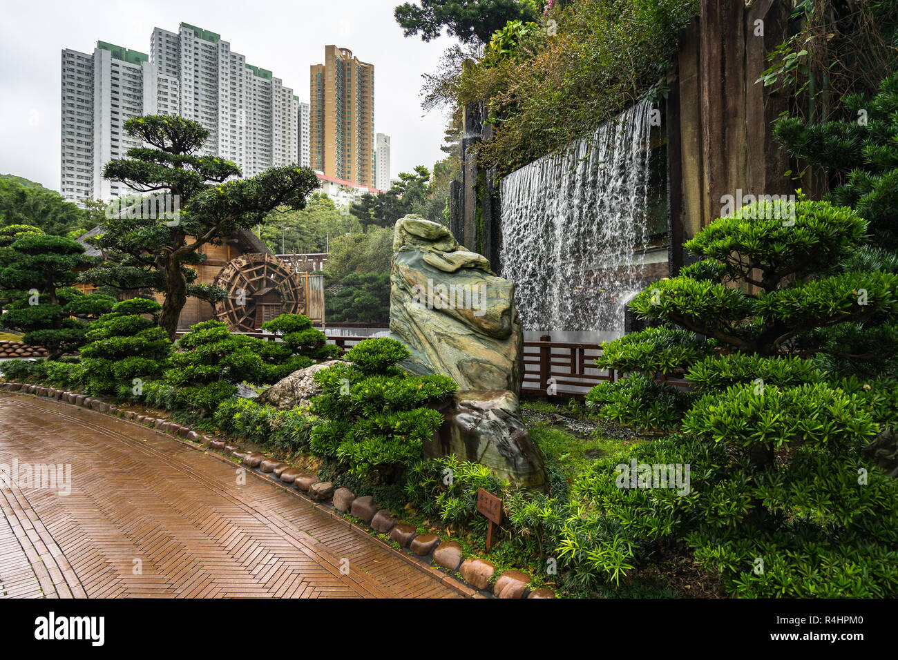Waterfall and and waterwheel at Nan Lian Garden, Chi Lin Nunnery, Hong Kong, Diamond Hill Stock Photo