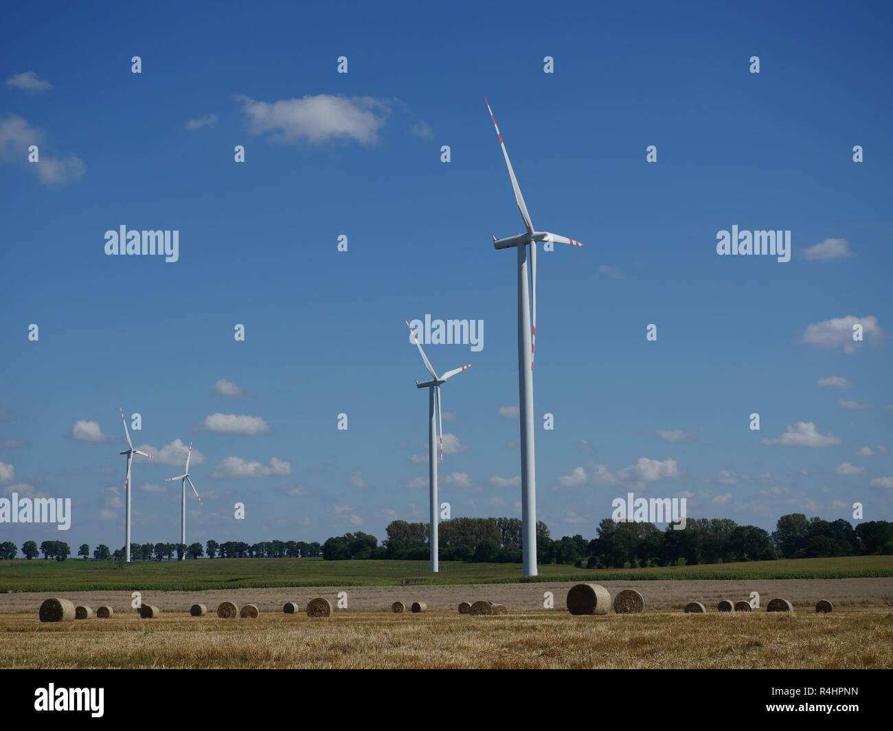 wind turbine on blue sky background Stock Photo - Alamy