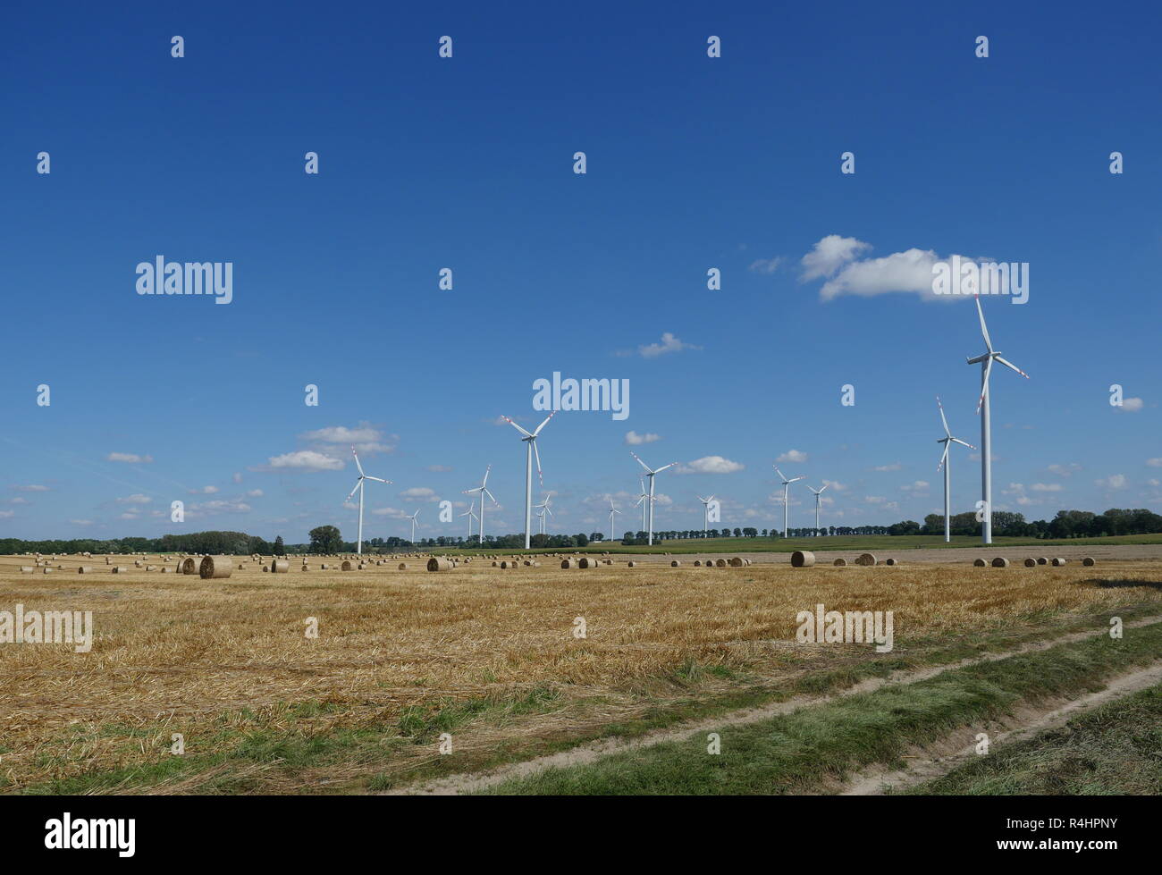 wind turbine on blue sky background Stock Photo - Alamy