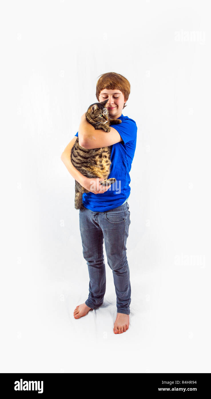 boy holding his cat in the arms Stock Photo