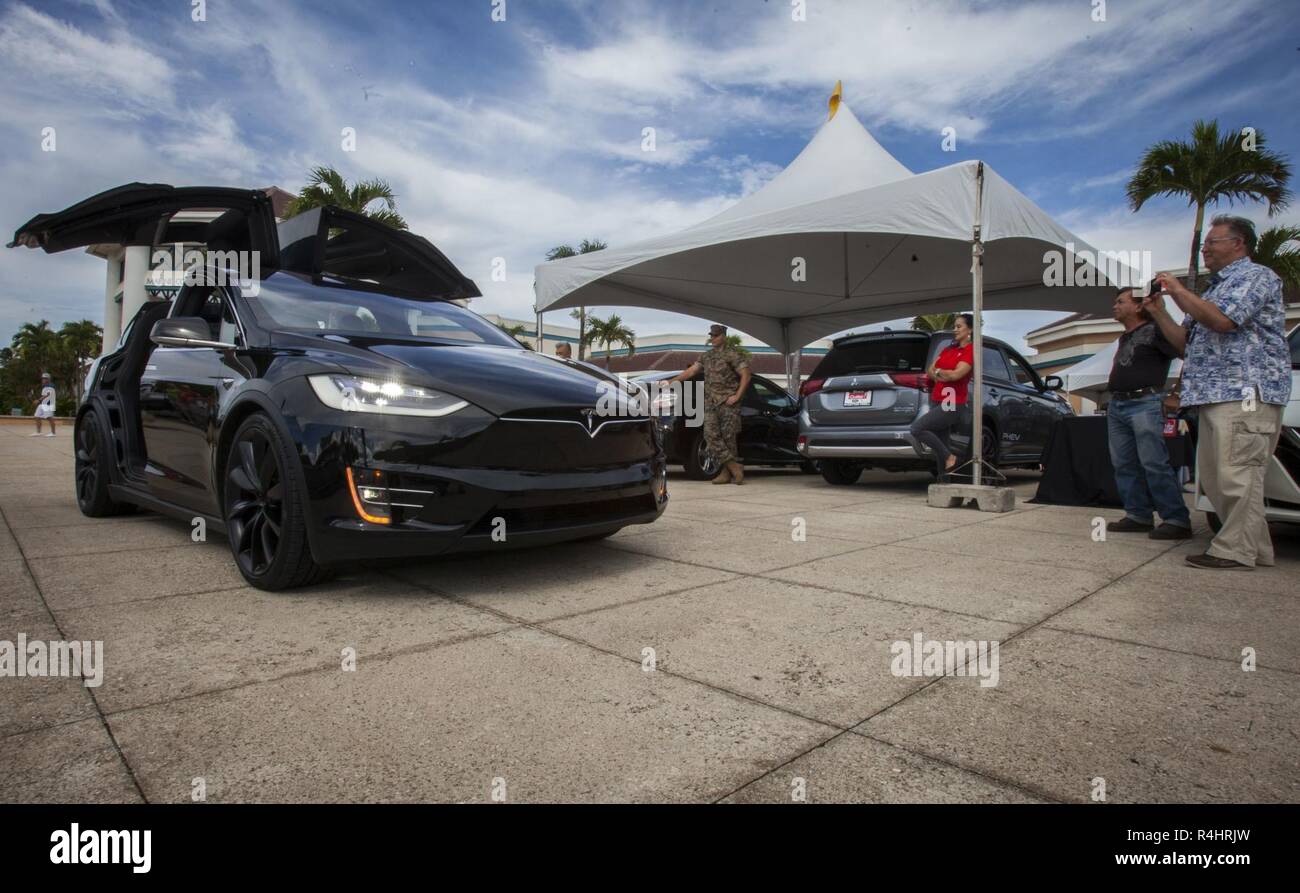 Spectators Look At A Tesla Model X P100d On Display During