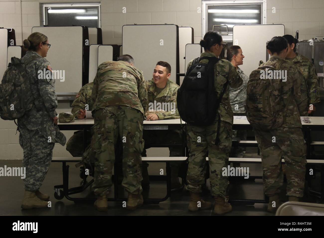 U.S. Army Spec. Jeremy Britten, center, of the 224th Sustainment ...