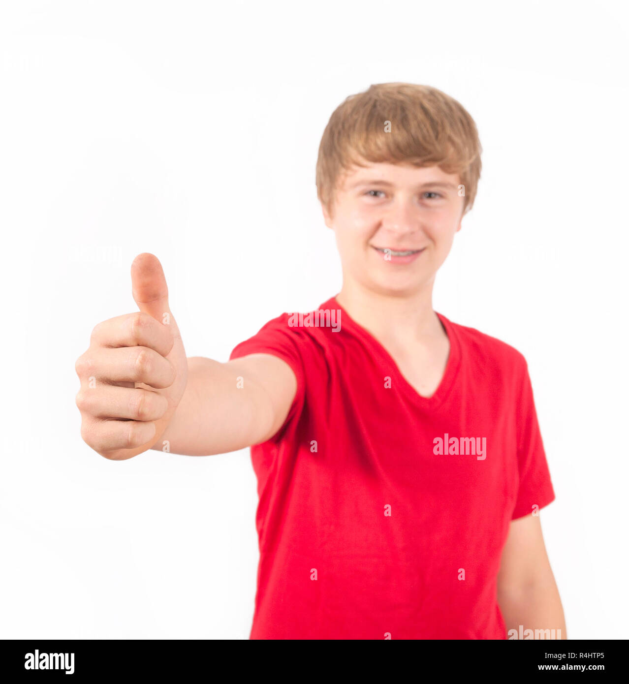 cute boy giving a thumbs up sign Stock Photo - Alamy