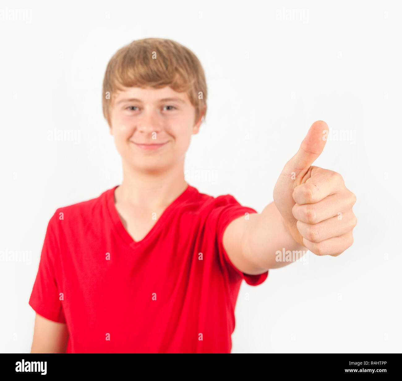 cute boy giving a thumbs up sign Stock Photo - Alamy