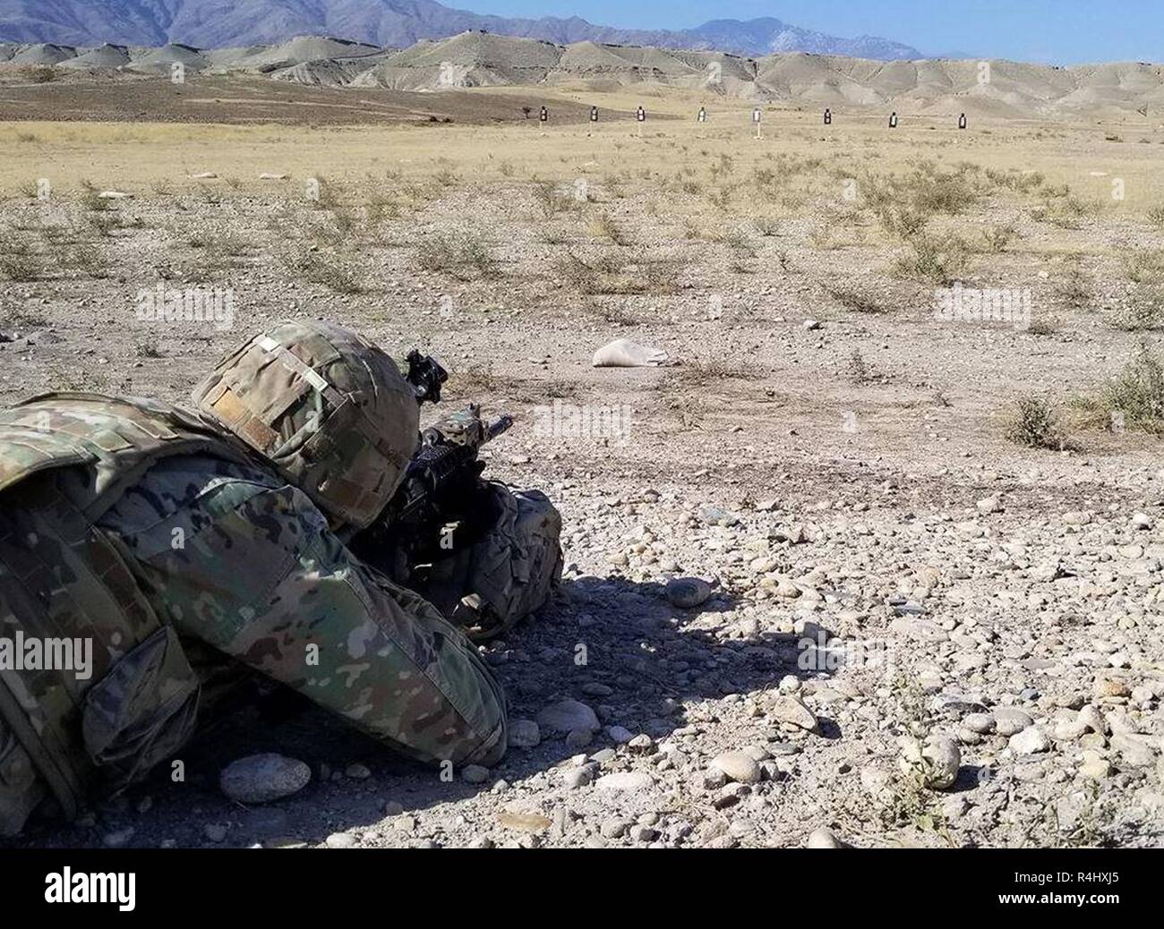 Raider Brigade Soldier from 1st Battalion, 38th Infantry Regiment, 1st Stryker Brigade Combat Team, 4th Infantry Division engage targets at a long range training exercise with his M4 rifle to remain Ready to execute during operations in Afghanistan, September 25, 2018. Stock Photo