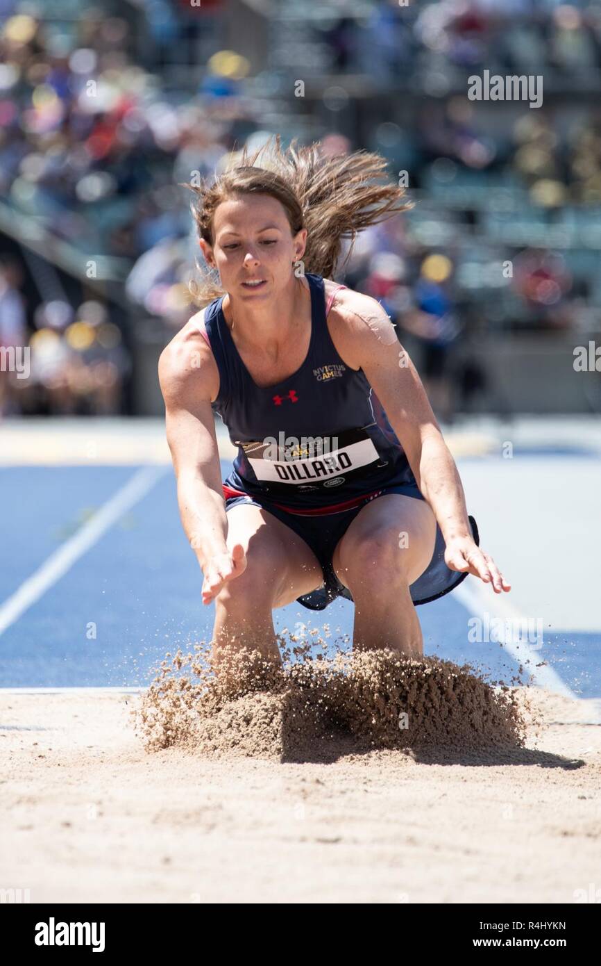 Master Sgt. Linn Dillard, USAF, impacts after completing her long jump ...
