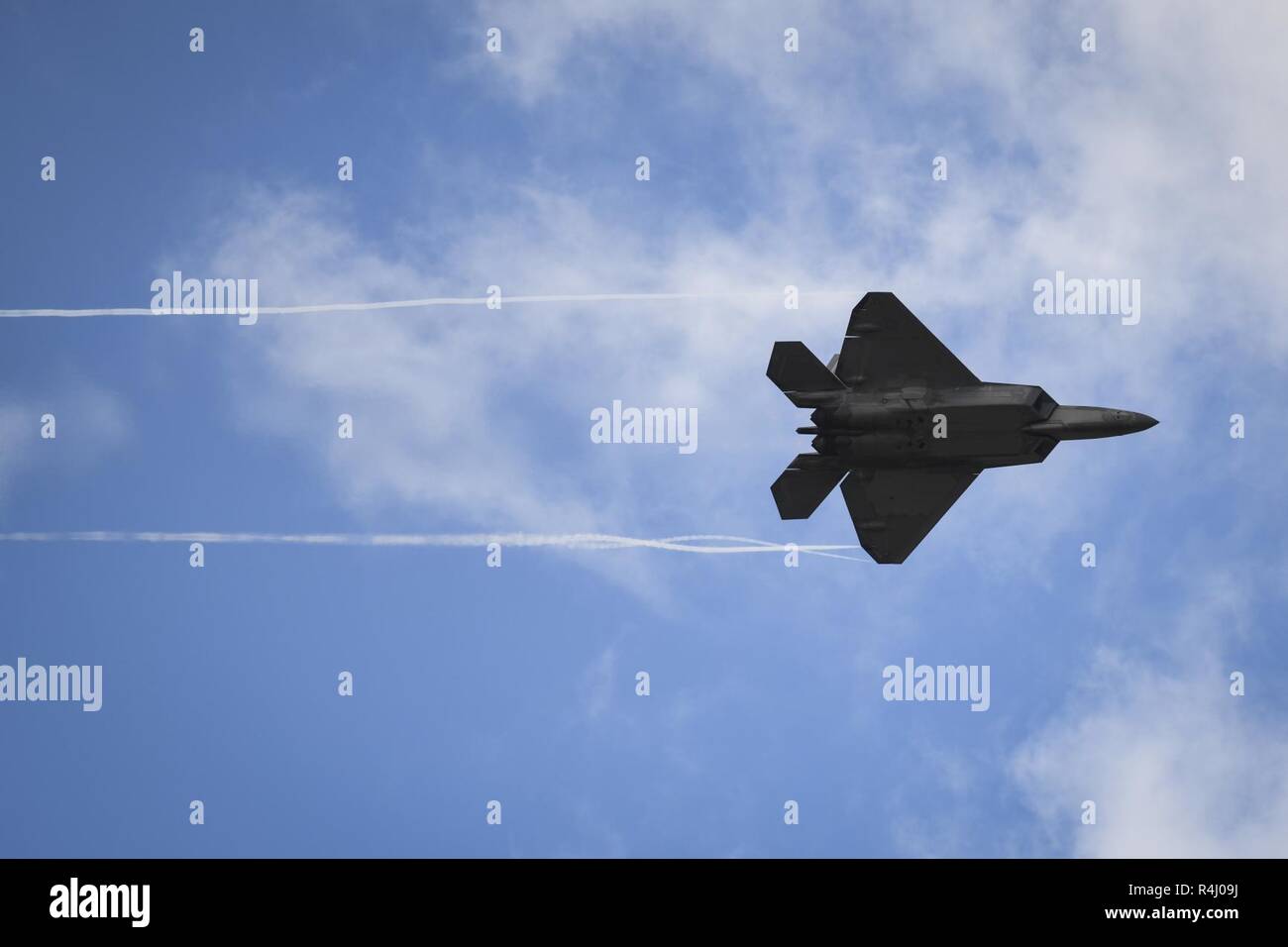 An F-22 Raptor from the Air Combat Commands Raptor Demonstration Team performs a flyover during an aerial demonstration at the U.S. Air Force Master Sgt. John A. Chapman Medal of Honor celebration at Hurlburt Field, Florida, Oct. 26, 2018. During the event, 12 aircraft from across the Air Force participated in an aerial demonstration in honor of Master Sgt. John Chapman, a combat controller who made the ultimate sacrifice during an intense battle in the mountains of Afghanistan. Chapman was posthumously awarded the Medal of Honor on Aug. 22, 2018. Stock Photo