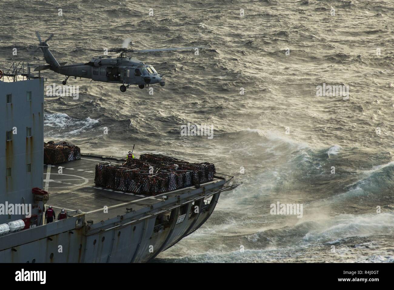 An SH-60 Seahawk retrieves supplies from Fleet Replenishment Oiler ...