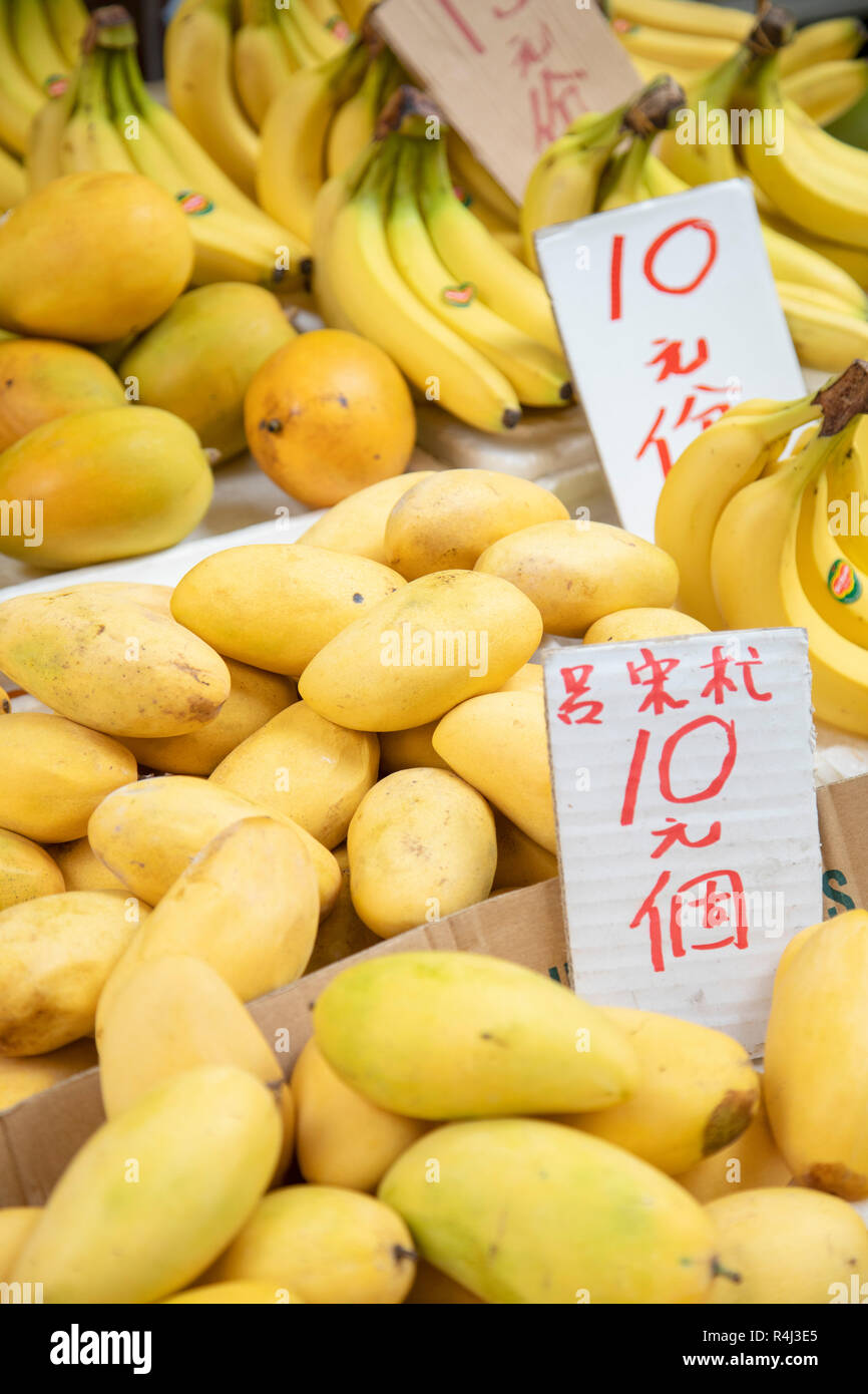 Mangoes and bananas on fruit stall at Battery Street Market, Yau Ma Tei