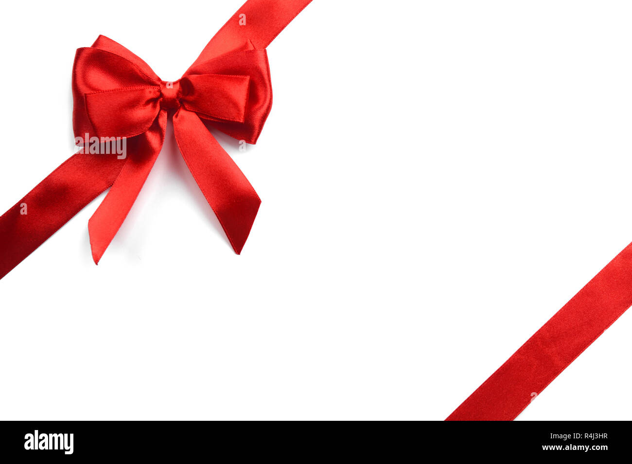 Shiny red satin ribbon on white background Stock Photo