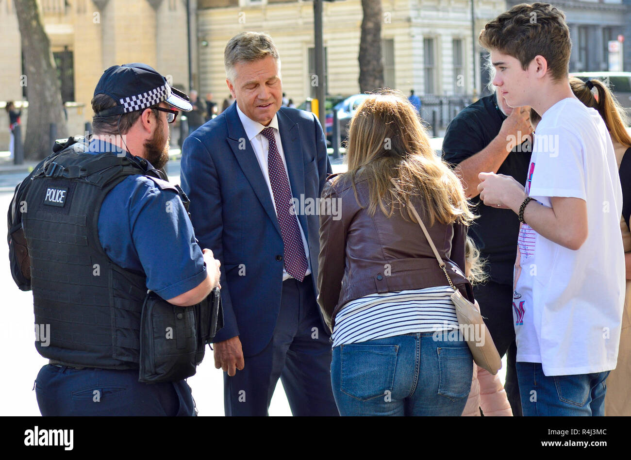 Andy Bell - Political Editor, Channel 5 News - outside Downing Street, 2018. Talking to police and a family after a young girl was knocked over by his Stock Photo