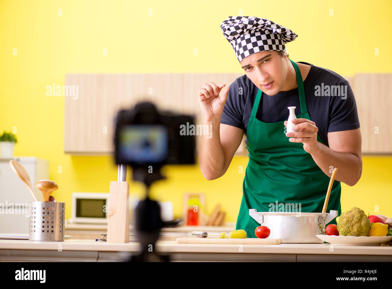 Young chef blogger explaining food preparation Stock Photo