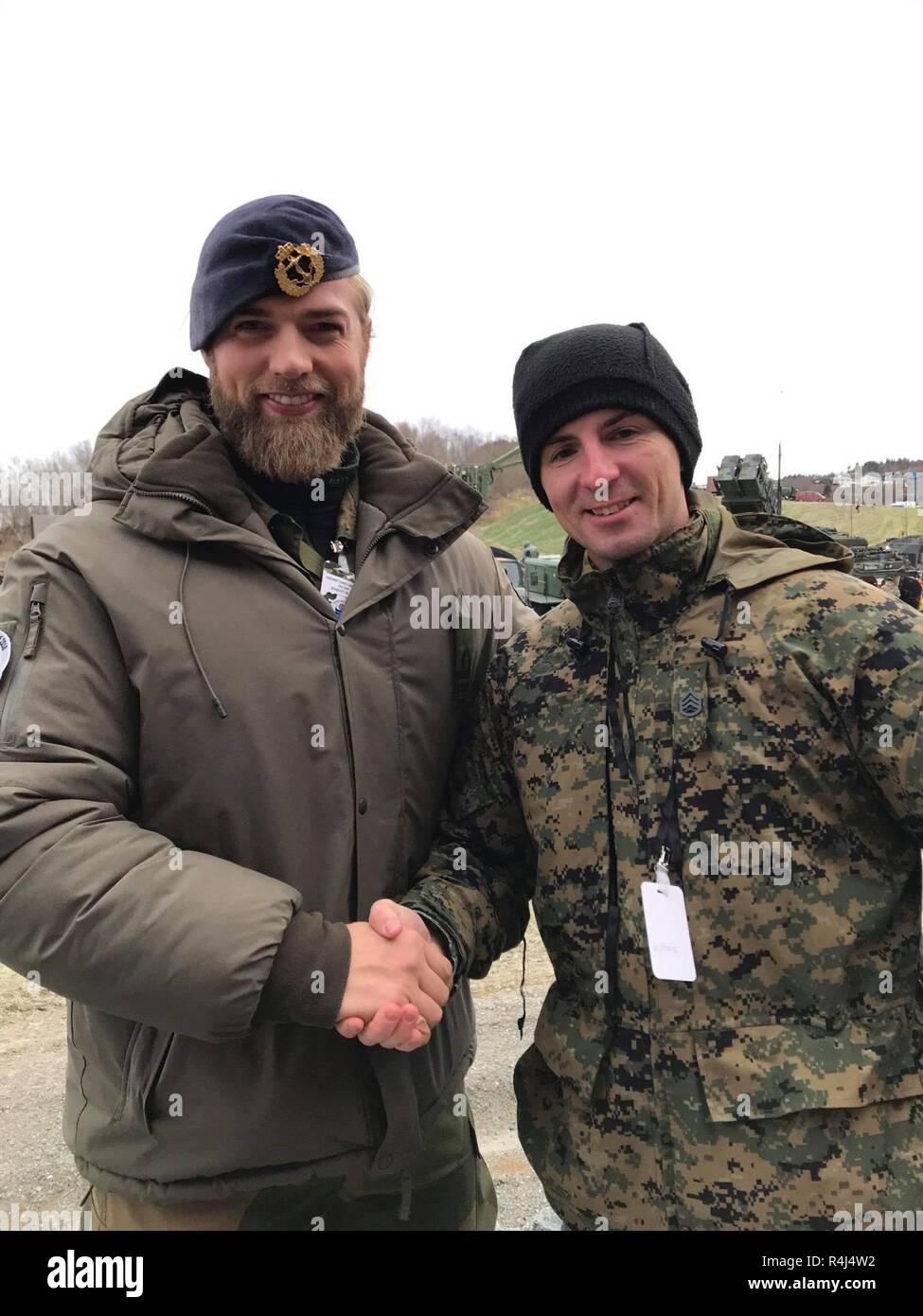 Norwegian Navy Lt. Lasse Løkken Matberg (left), a sports officer with  NATO's Joint Warfare Center in Stavanger, and Staff Sgt. Marcin Platek, a  Marine with Marine Forces Europe and Africa, build new