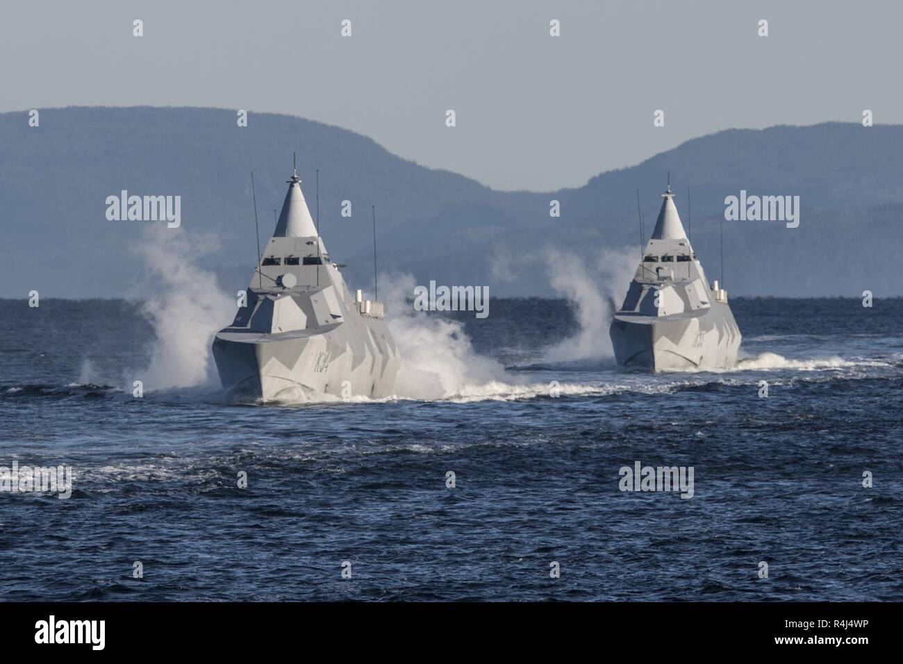 His Swedish Majesty’s Ships NYKOPING and KARLSTAD sail through The Trondheim Fjord during Exercise TRIDENT JUNCTURE on October 26, 2018.    With around 50,000 personnel participating in Trident Juncture 2018, it is one of the largest NATO exercises in recent years. Around 250 aircraft, 65 vessels and more than 10,000 vehicles are involved in the exercise in Norway. Stock Photo