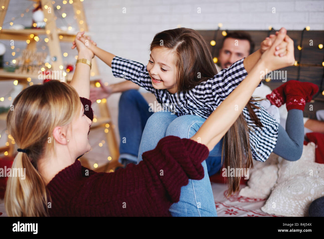 Family spending christmas time together in bed Stock Photo