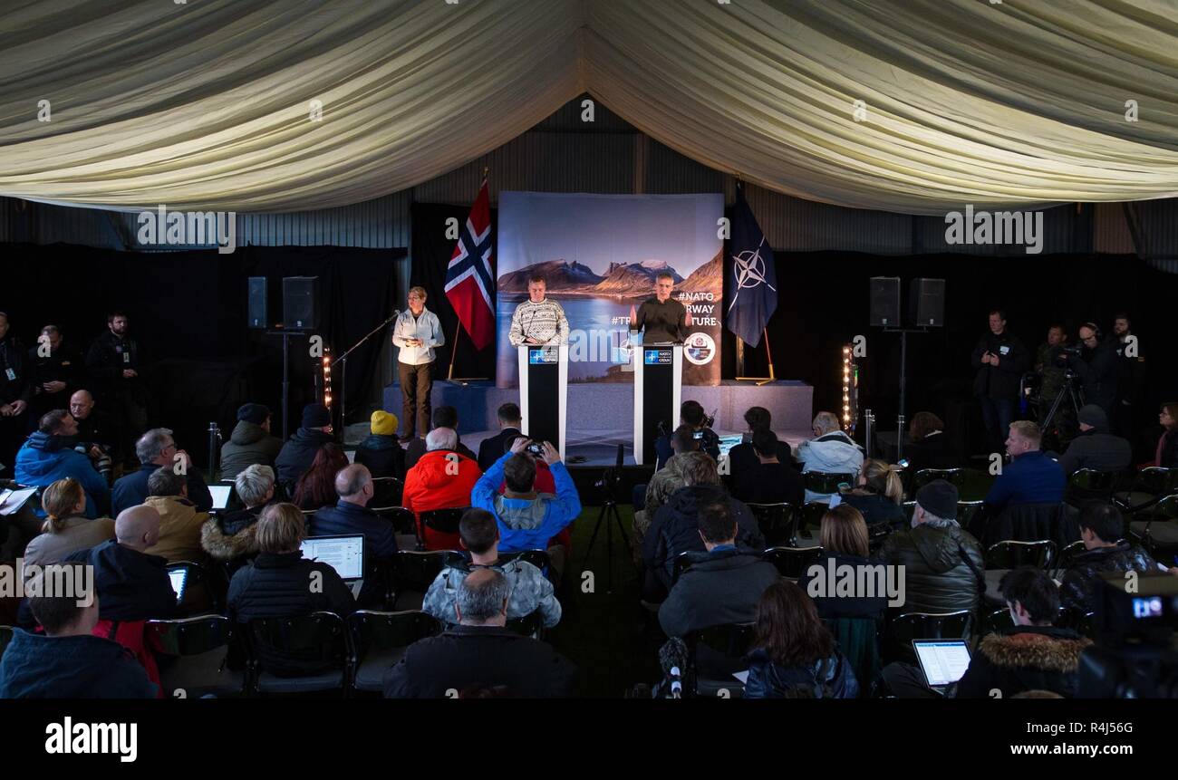 NATO Secretary General, Jens Stoltenberg (right), and Norwegian Defense Minister, Frank Bakke-Jensen (left), address the medias during Exercise TRIDENT JUNCTURE 2018 Distinguished Visitor Day in Trondheim, Norway, on October 30, 2018.    With around 50,000 personnel participating in Trident Juncture 2018, it is one of the largest NATO exercises in recent years. Around 250 aircraft, 65 vessels and more than 10,000 vehicles are involved in the exercise in Norway. Stock Photo