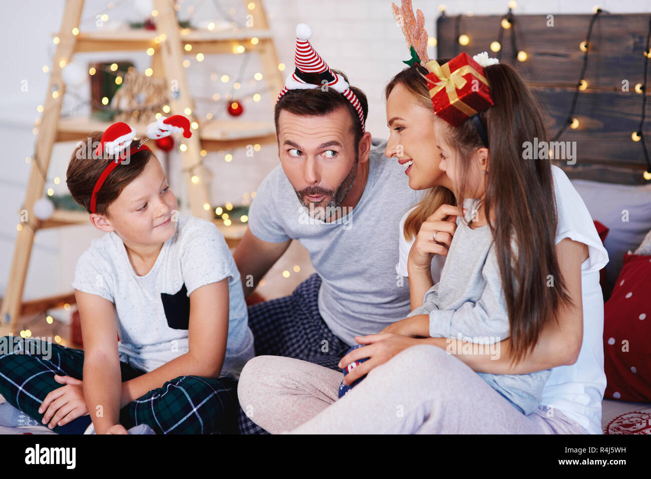 Family celebrating Christmas together at home Stock Photo