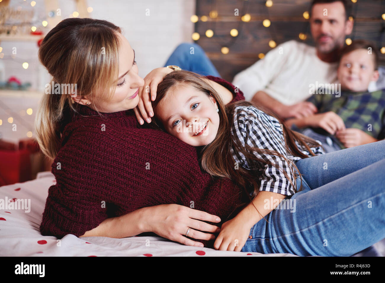 Affectionate mother embracing her daughter Stock Photo
