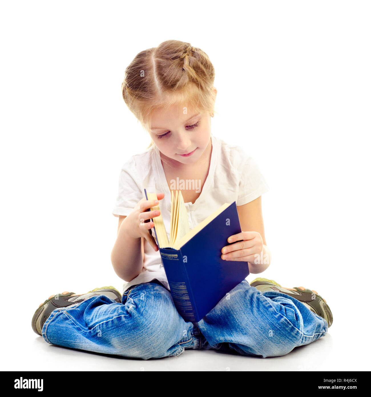 little girl reading book isolated on a white background Stock Photo - Alamy