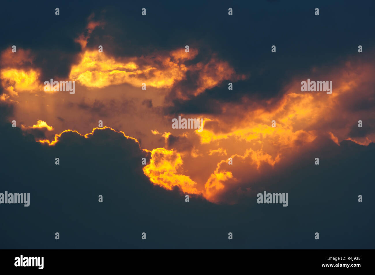 Fiery break in the dark clouds Stock Photo