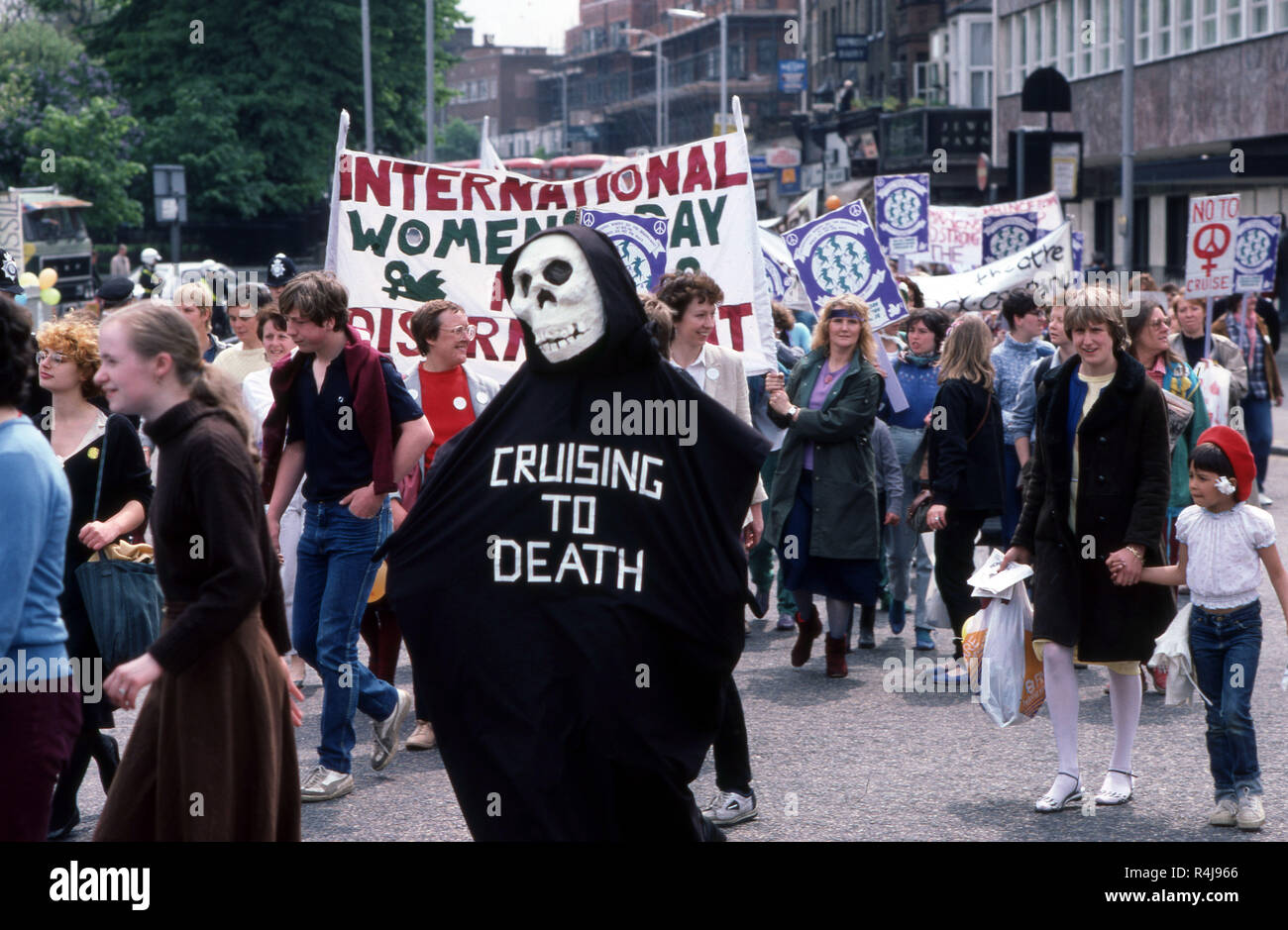 Anti-nuclear Demonstration in London in the 1980's with protester wearing a skull mask and clock that reads Cruising to Death Stock Photo