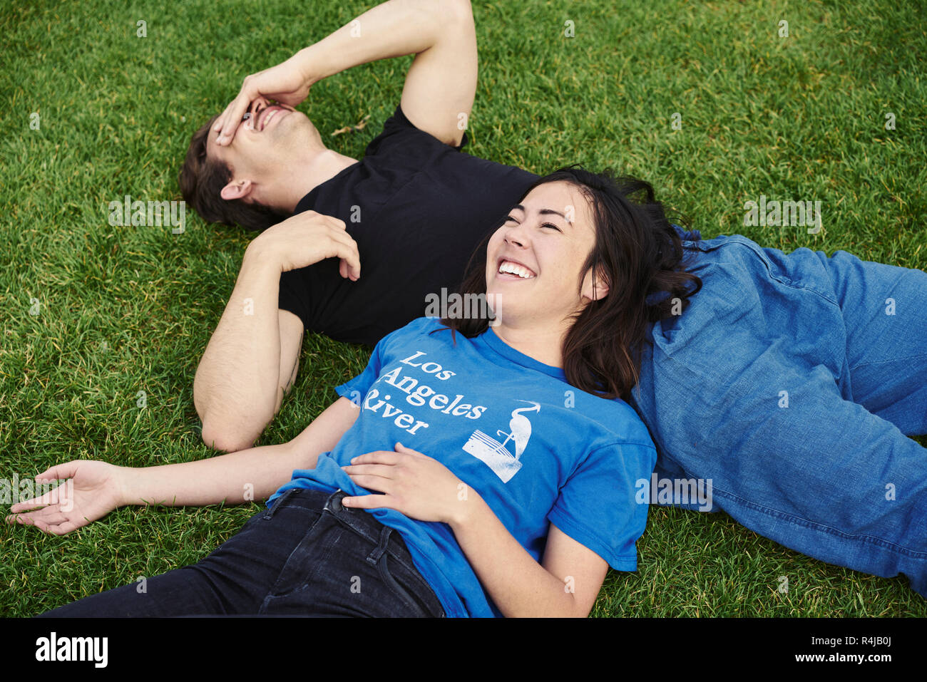 Couple laughing in a park in Copenhagen Stock Photo