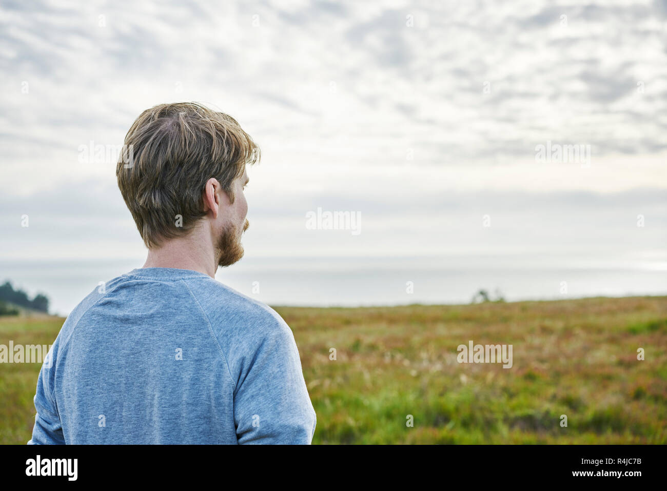 Mid adult man in field in California, USA Stock Photo