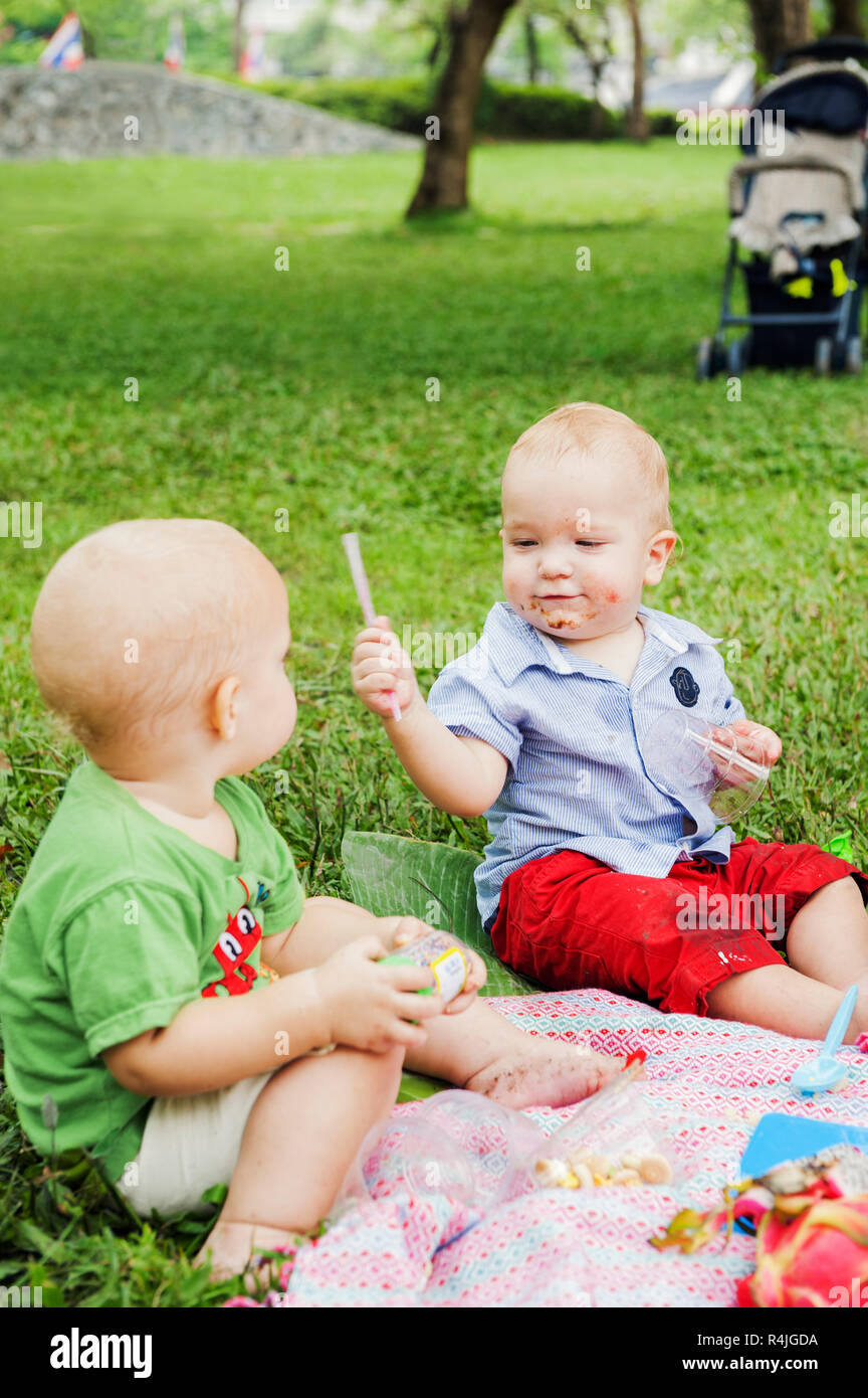 Baby boys at birthday picnic Stock Photo Alamy