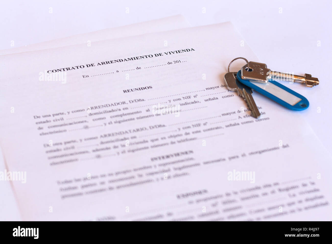 Spanish Lease / Rental agreement document with keys and pen. Stock Photo