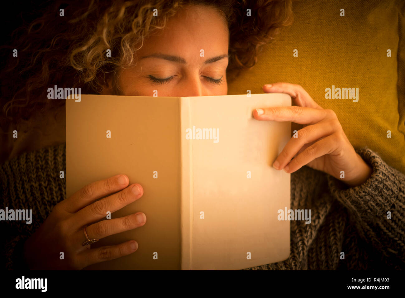 Nice lady sleep at home on the couch with 2019 diary covering his face. closed eyes and above view for people tired sleeping in peace - beauty warm au Stock Photo