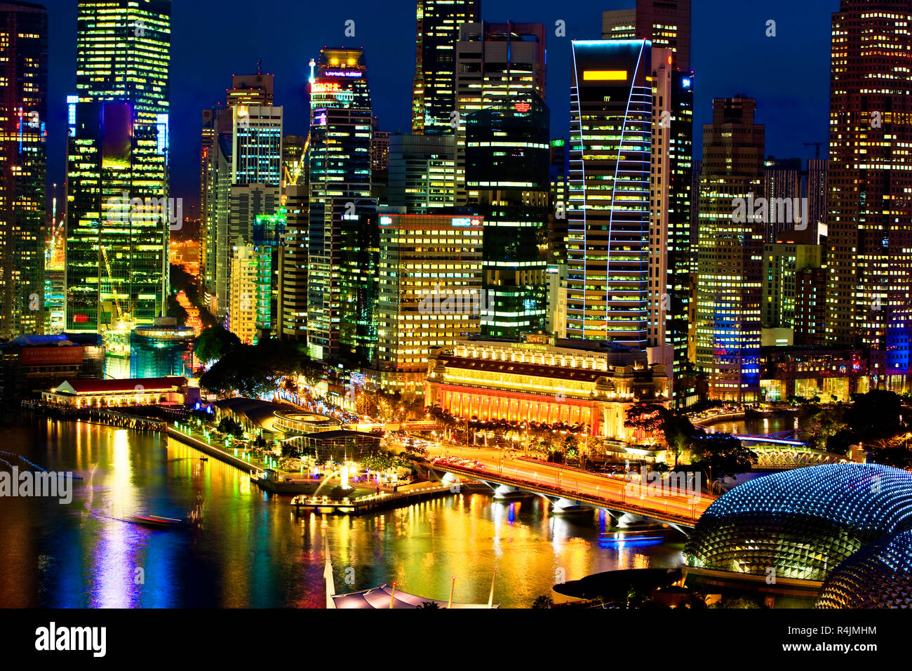 Singapore harbour and cityscape illuminated at night Stock Photo - Alamy