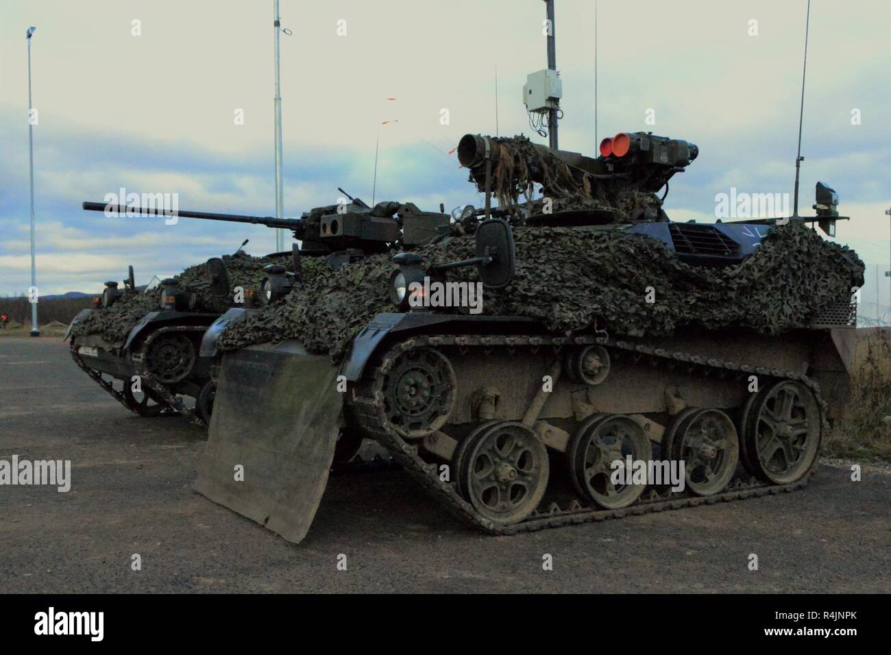 Photo of a German Bundeswehr Wiesel Armored Weapons Carrier at Rena Leir Airfield, Norway, Oct. 29, 2018 during Trident Juncture 18. Trident Juncture is a NATO-led military exercise held in Norway. The exercise is the largest of its kind in Norway since the 1980s. An expected 51,000 participants from over 30 nations will take part, including 10,000 vehicles, 150 aircraft and 60 vessels. The main goals of Trident Juncture is to train the NATO Response Force and to test the alliance's defense capabilities. Stock Photo