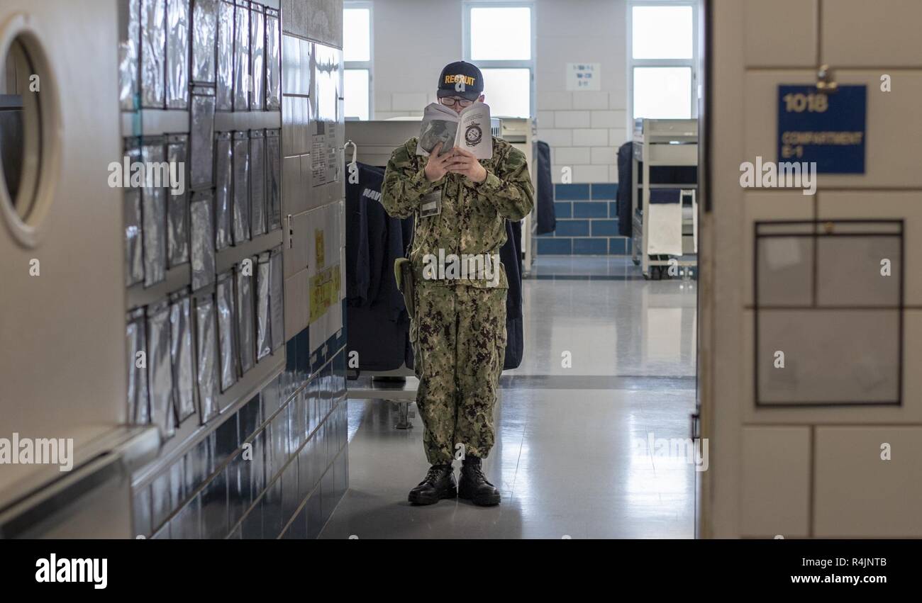 Great Lakes Ill Oct 29 2018 A Recruit Studies His Recruit Training Guide While Standing Security Watch At The Entrance To His Compartment In The Uss Kearsarge Recruit Barracks At Recruit Training