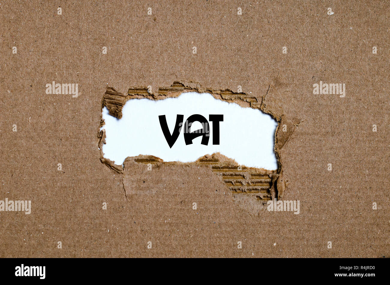 The word vat appearing behind torn paper Stock Photo Alamy