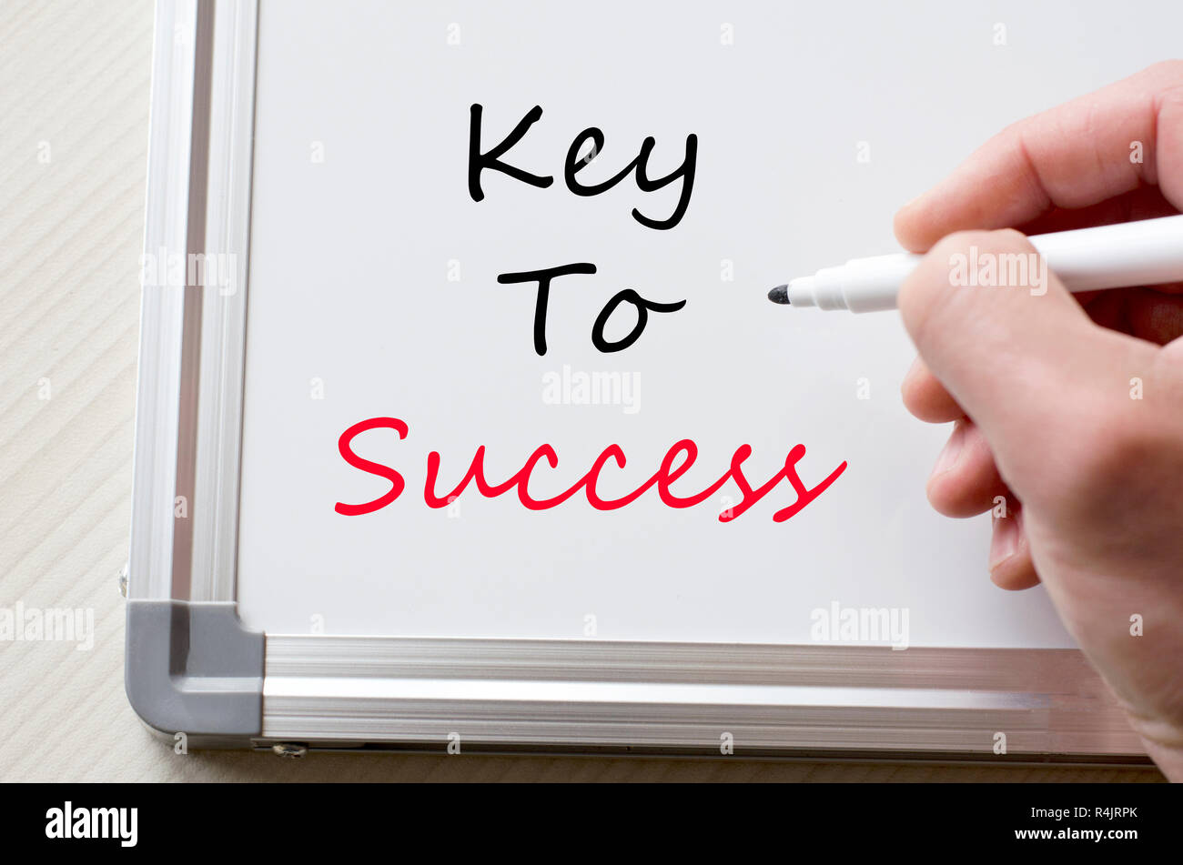 Key to success written on whiteboard Stock Photo