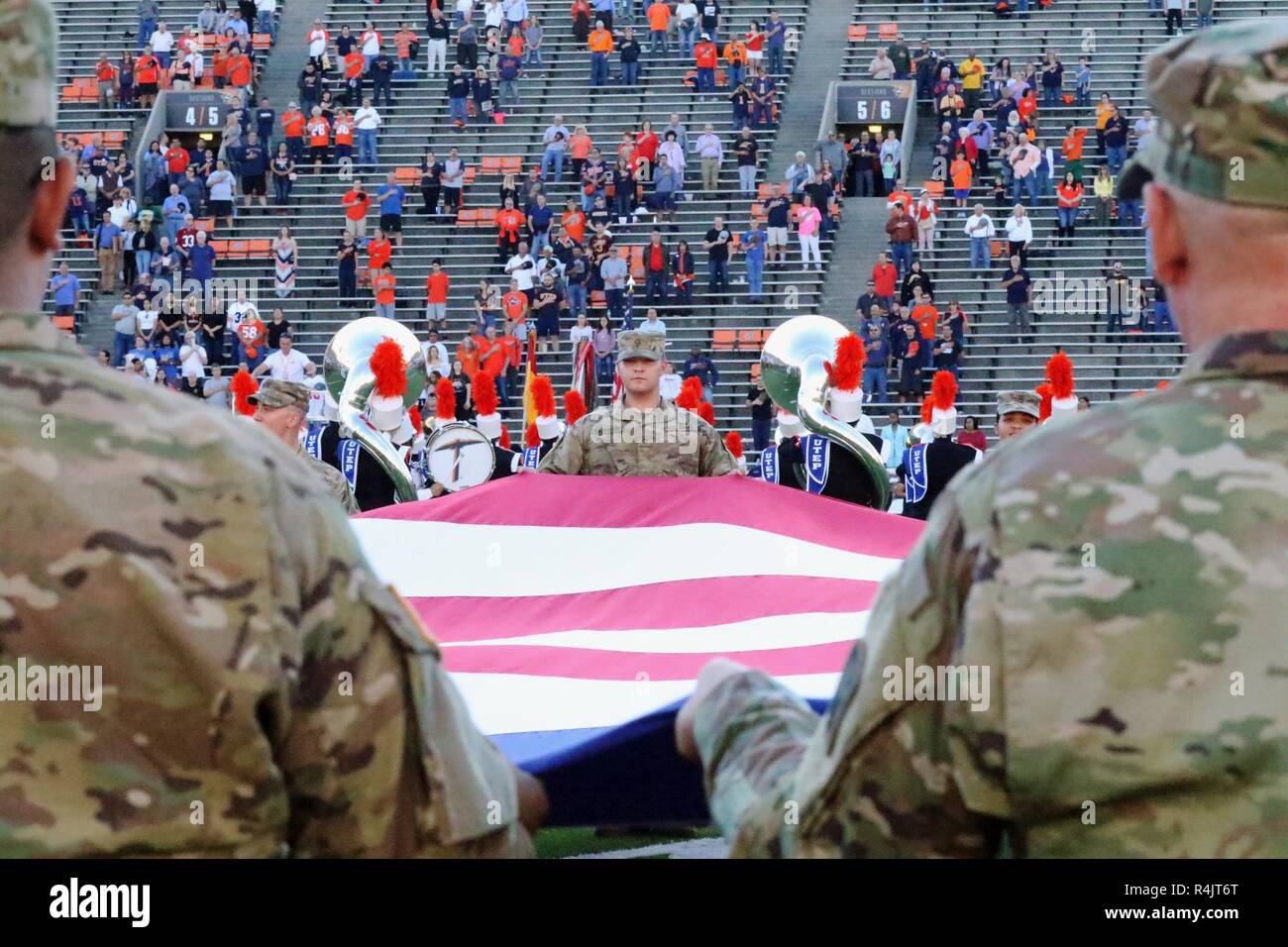 Soldiers assigned to 1st Armored Division hold the US Colors while the