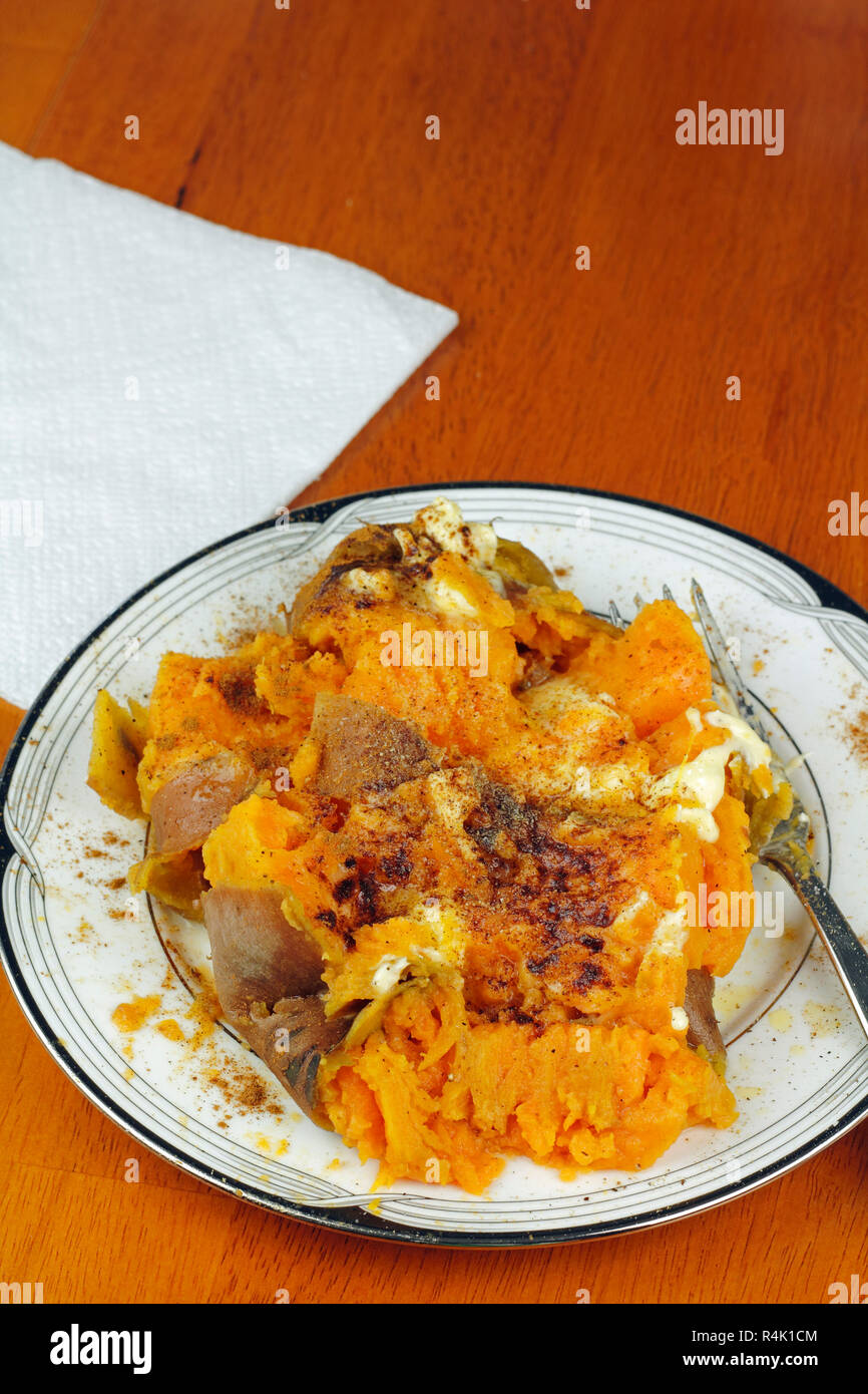 Prepared Sweet Potato with Butter and Cinnamon Stock Photo