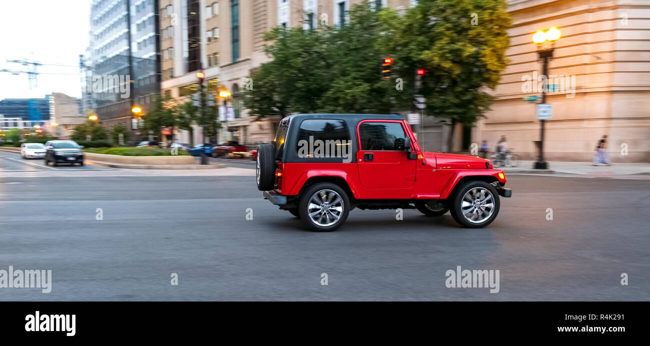blur effect of red cross-country vehicle in the streets of Washington DC Stock Photo