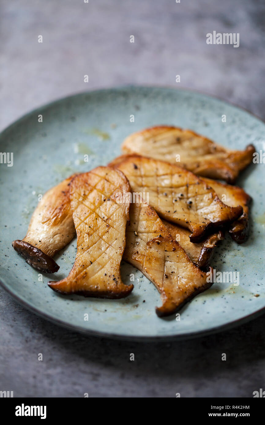 King oyster mushrooms sautee in butter with salt and pepper Stock Photo