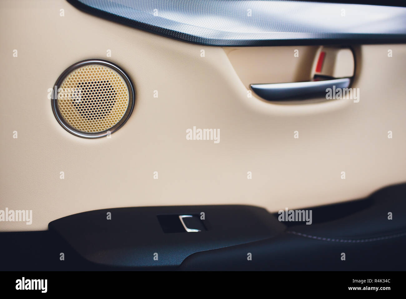 car leather interior details of door handle with windows controls and adjustments. Car window