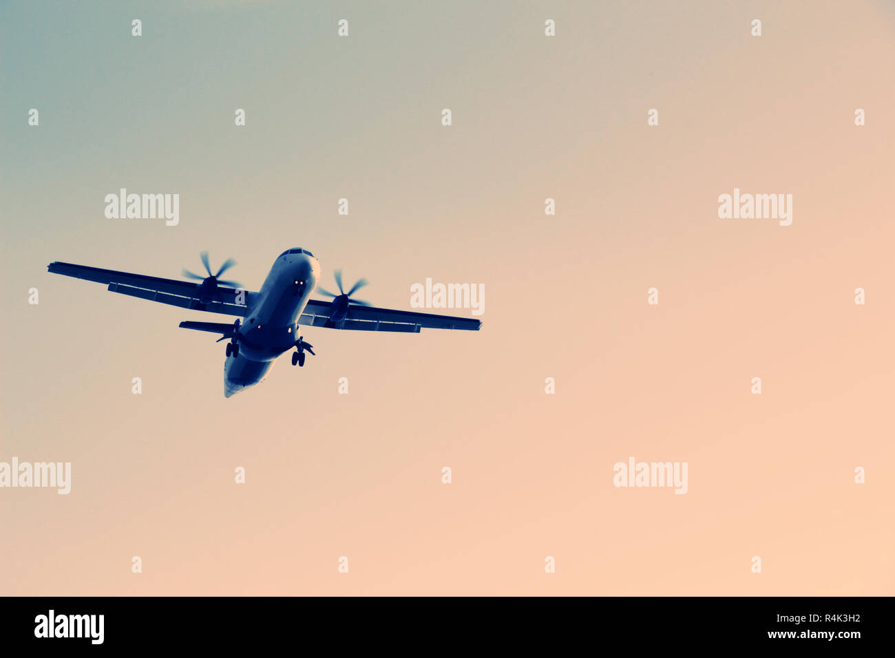 Airplane flying in the sky Stock Photo - Alamy
