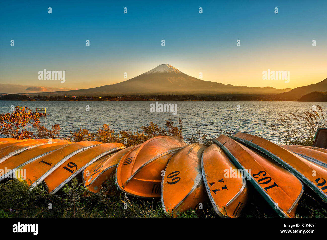 Mt. Fuji over Lake Kawaguchiko with boats at sunset in Fujikawaguchiko