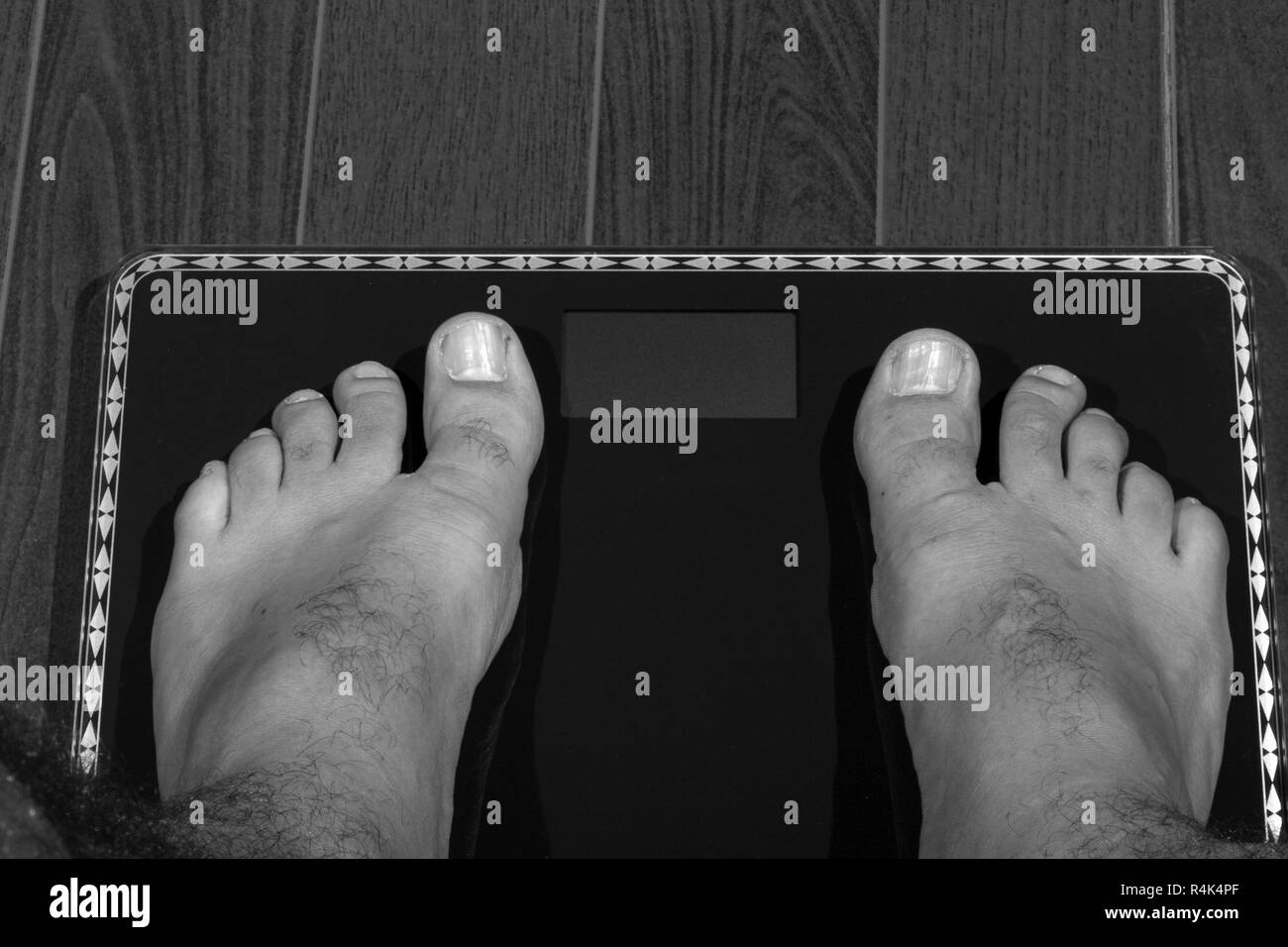 check weight foot digital black white Stock Photo
