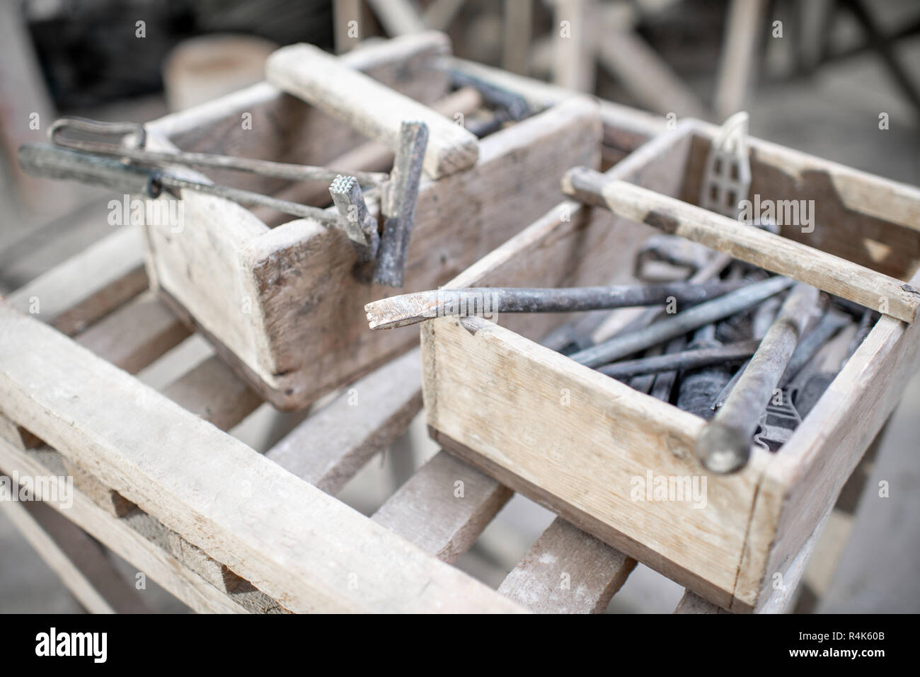 Sculptor's working tools in the wooden boxes Stock Photo