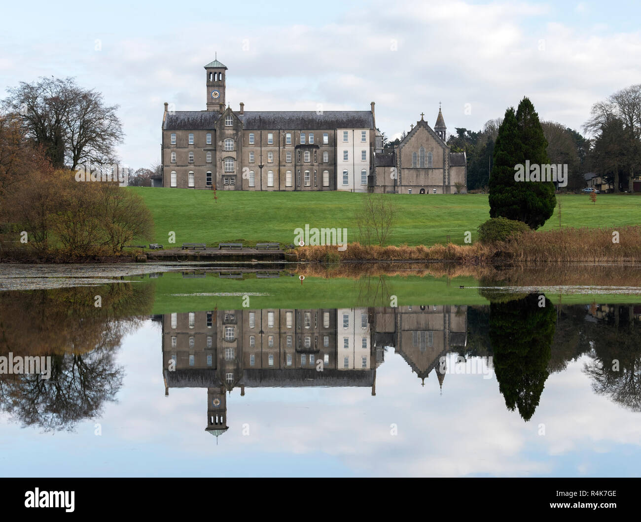 Rockwell College with reflection in lake, Cashel, Co Tipperary, Ireland Stock Photo
