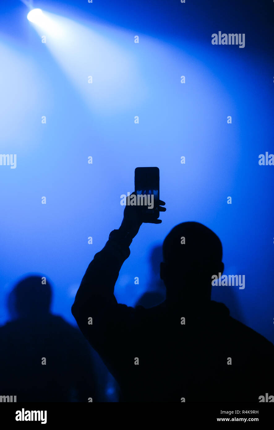 Music fan filming concert with smart phone camera Stock Photo Alamy