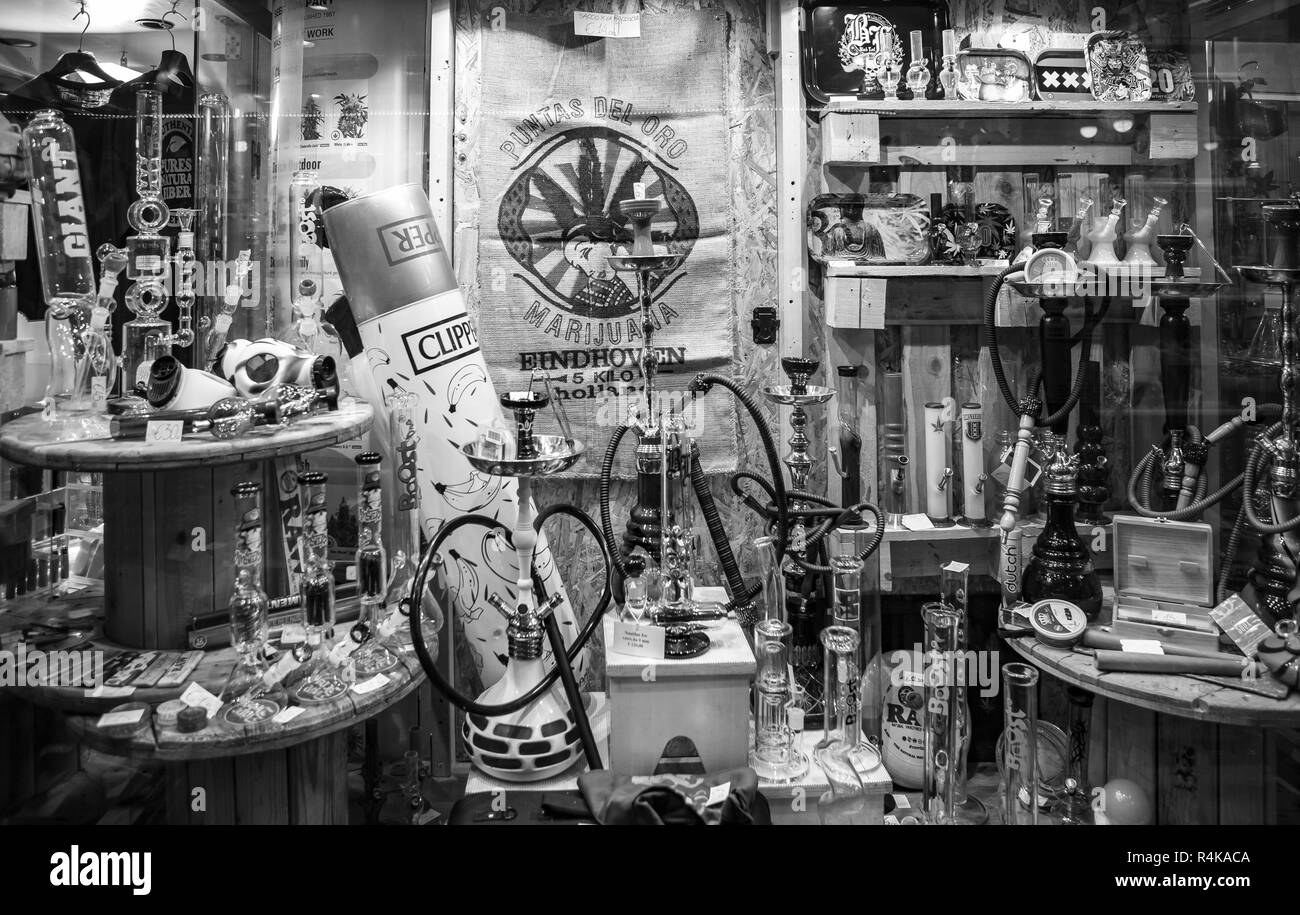 GENOVA,ITALY-12 OCTOBER,2018: Ganja shop sell legalized marijuana, glass bong pipes and accessories for smoking weed.Legal light drug store in close u Stock Photo