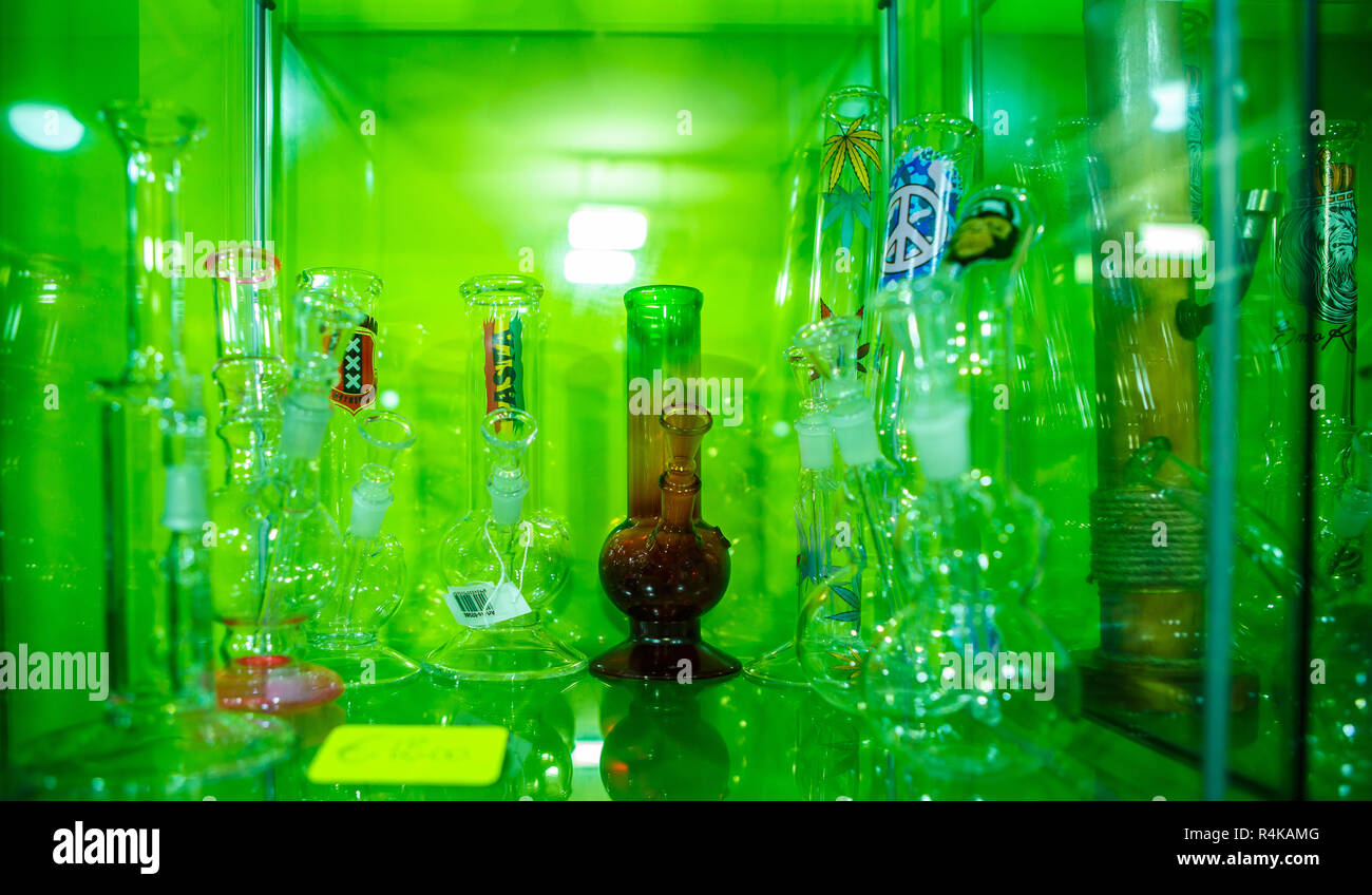 Glass pipe or bong for marijuana smoking on a blue fabric background Stock  Photo - Alamy